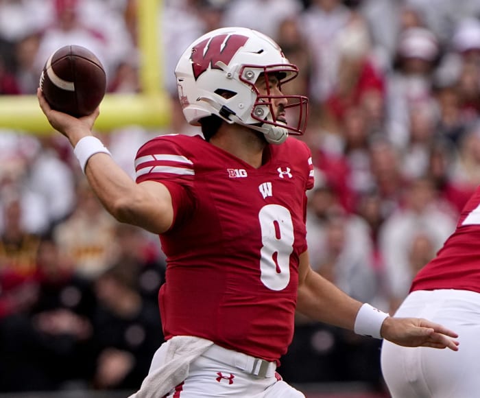 Wisconsin quarterback Tanner Mordecai (8) looks for an open receiver during the second quarter of their game against Iowa Saturday, October 14, 2023 at Camp Randall Stadium in Madison, Wisconsin.
